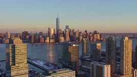 4.8K aerial stock footage approach Lower Manhattan skyline, New York City, sunset, from Jersey City Aerial Stock Footage | AX66_0250E