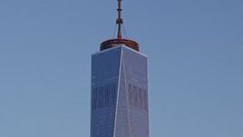 4.8K aerial stock footage tilt down the side of One World Trade Center, Lower Manhattan, New York City, sunset Aerial Stock Footage | AX66_0265