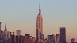 4.8K aerial stock footage of the famous Empire State Building in winter, Midtown Manhattan, New York City, sunset Aerial Stock Footage | AX66_0270