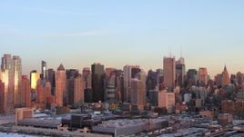 4.8K aerial stock footage of Midtown Manhattan skyscrapers in winter, New York City, sunset Aerial Stock Footage | AX66_0271