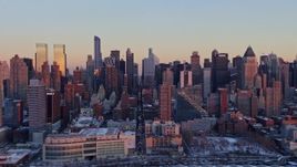 4.8K aerial stock footage of Hell's Kitchen, Midtown Manhattan, and Upper West Side in winter, New York City, sunset Aerial Stock Footage | AX66_0274E