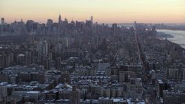4.8K aerial stock footage tilt from Midtown skyline, reveal Columbia University in winter, New York City, twilight Aerial Stock Footage | AX66_0287