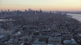 4.8K aerial stock footage tilt from Midtown to reveal Columbia University in winter, New York City, twilight Aerial Stock Footage | AX66_0293