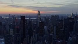 4.8K aerial stock footage approach famous Chrysler Building and Empire State Building in winter, New York City, twilight Aerial Stock Footage | AX66_0323
