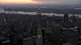 4.8K aerial stock footage Empire State Building seen from Chrysler Building in winter, New York City, twilight Aerial Stock Footage | AX66_0326