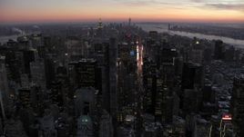 4.8K aerial stock footage an approach to Times Square and Midtown in winter, New York City, twilight Aerial Stock Footage | AX66_0336