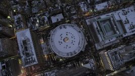 4.8K aerial stock footage of a bird's eye view of Madison Square Garden in snow, New York City, twilight Aerial Stock Footage | AX66_0341