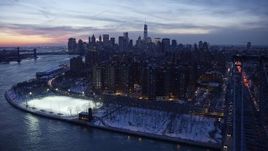 4.8K aerial stock footage of Williamsburg Bridge, Lower East Side, Lower Manhattan in winter, New York City, twilight Aerial Stock Footage | AX66_0360E