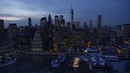 4.8K aerial stock footage of Lower Manhattan skyscrapers in snow, New York City, twilight Aerial Stock Footage | AX66_0371E