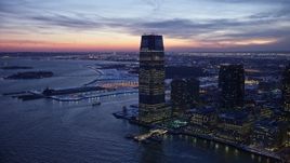 4.8K aerial stock footage of Goldman Sachs Tower in Jersey City in winter, New Jersey, twilight Aerial Stock Footage | AX66_0383
