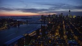 4.8K aerial stock footage of Manhattan and Brooklyn Bridges, Lower East Side apartments in winter, New York City, twilight Aerial Stock Footage | AX66_0392E