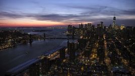4.8K aerial stock footage of Manhattan and Brooklyn Bridges, Lower East Side apartments in winter, New York City, twilight Aerial Stock Footage | AX66_0395
