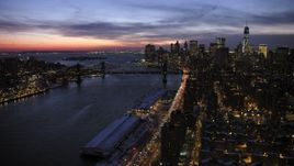 4.8K aerial stock footage of Manhattan and Bridge Brooklyn Bridges and Lower Manhattan Skyline in winter, New York City, twilight Aerial Stock Footage | AX66_0396