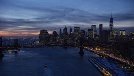 4.8K aerial stock footage video of Manhattan Bridge and Lower Manhattan skyline, New York City, twilight Aerial Stock Footage | AX66_0397