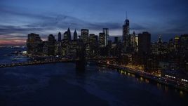 4.8K aerial stock footage of Manhattan and Brooklyn Bridges, approaching Lower Manhattan skyline, New York City, twilight Aerial Stock Footage | AX66_0398E