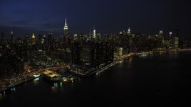 4.8K aerial stock footage of tall Midtown Manhattan skyscrapers, New York City, night Aerial Stock Footage | AX66_0414