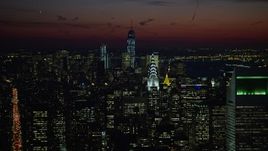 4.8K aerial stock footage of Lower Manhattan skyscrapers, Chrysler, and Empire State Building, New York City, night Aerial Stock Footage | AX66_0427E