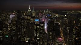 4.8K aerial stock footage of Times Square and Midtown Manhattan skyscrapers, New York City, night Aerial Stock Footage | AX66_0433