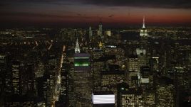 4.8K aerial stock footage of Empire State and Chrysler Buildings, and Lower Manhattan, New York City, night Aerial Stock Footage | AX66_0438