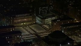 4.8K aerial stock footage view of orbiting the snowy campus at Columbia University at night, New York City, New York Aerial Stock Footage | AX67_0007