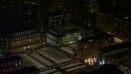 4.8K aerial stock footage view of Lerner Hall and snowy campus at Columbia University at night, New York City, New York Aerial Stock Footage | AX67_0008