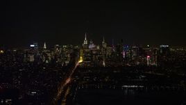 4.8K aerial stock footage view of a view of the Midtown Manhattan skyline at night, New York City, New York Aerial Stock Footage | AX67_0012