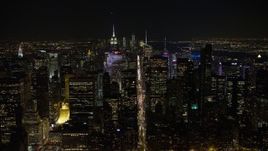 4.8K aerial stock footage view fly over 6th Avenue toward Midtown Manhattan at night, New York City, New York Aerial Stock Footage | AX67_0017