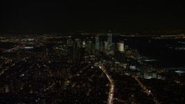 4.8K aerial stock footage view of Lower Manhattan skyline at night in New York City, New York Aerial Stock Footage | AX67_0022