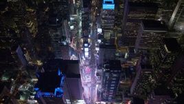 4.8K aerial stock footage view of tilting to a bird's eye view of bright lights of Time Square in New York City, New York Aerial Stock Footage | AX67_0023