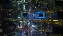 4.8K aerial stock footage view of tilting to a bird's eye view of bright lights of Time Square in New York City, New York Aerial Stock Footage | AX67_0024