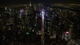 4.8K aerial stock footage view follow 7th Avenue to approach Times Square at night, Midtown Manhattan, New York City, New York Aerial Stock Footage | AX67_0027