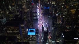 4.8K aerial stock footage view follow 7th Avenue to approach Times Square at night, Midtown Manhattan, New York City, New York Aerial Stock Footage | AX67_0028