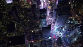 4.8K aerial stock footage view of Times Square and skyscrapers at night, Midtown Manhattan, New York City, New York Aerial Stock Footage | AX67_0033