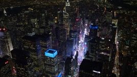 4.8K aerial stock footage view tilt from Times Square to reveal Empire State Building at night, Midtown Manhattan, New York City, New York Aerial Stock Footage | AX67_0036