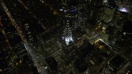 4.8K aerial stock footage view approach Chrysler Building and tilt to bird's eye view at night in Midtown Manhattan, New York City, New York Aerial Stock Footage | AX67_0038
