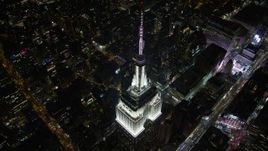 4.8K aerial stock footage view approach the Empire State Building at night, Midtown Manhattan, New York City, New York Aerial Stock Footage | AX67_0039