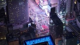 4.8K aerial stock footage view of tourists visiting Times Square at night, Midtown Manhattan, New York City, New York Aerial Stock Footage | AX67_0042