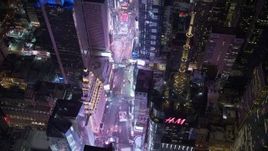 4.8K aerial stock footage view of looking down on Times Square at night, Midtown Manhattan, New York City, New York Aerial Stock Footage | AX67_0044