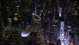 4.8K aerial stock footage view of orbiting Bank of America Tower and fly away at night, Midtown Manhattan, New York City, New York Aerial Stock Footage | AX67_0045