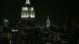 4.8K aerial stock footage view flyby the Empire State Building and Chrysler Building at night, Midtown Manhattan, New York City, New York Aerial Stock Footage | AX67_0050