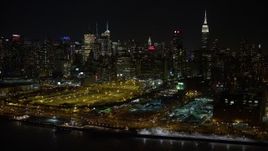 4.8K aerial stock footage view of Hudson Yards and Hell's Kitchen skyscrapers at night, Midtown Manhattan, New York City Aerial Stock Footage | AX67_0052