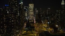 4.8K aerial stock footage view of skyscrapers in the Hell's Kitchen area at night, Midtown Manhattan, New York City Aerial Stock Footage | AX67_0054