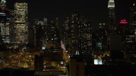 4.8K aerial stock footage view of passing Hell's Kitchen area of Midtown Manhattan at night, New York Aerial Stock Footage | AX67_0060