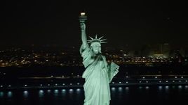 4.8K aerial stock footage view of orbiting the famous Statue of Liberty at night, New York Aerial Stock Footage | AX67_0072