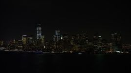 4.8K aerial stock footage view of approaching Lower Manhattan skyline at night, New York Aerial Stock Footage | AX67_0075