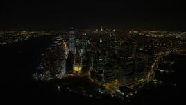 4.8K aerial stock footage view of orbiting Battery Park and Lower Manhattan's tall skyscrapers at night, New York Aerial Stock Footage | AX67_0084