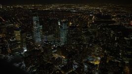4.8K aerial stock footage view of orbiting tall skyscrapers in Lower Manhattan and the World Trade Center at night, New York Aerial Stock Footage | AX67_0085