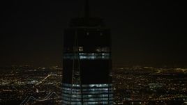 4.8K aerial stock footage view of orbiting top of One World Trade Center at night, Lower Manhattan, New York Aerial Stock Footage | AX67_0091