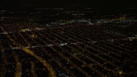 4.8K aerial stock footage view of passing urban neighborhoods in Queens at night, New York Aerial Stock Footage | AX67_0112