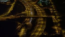 4.8K aerial stock footage view orbiting light traffic on a freeway at night, Long Island, New York Aerial Stock Footage | AX67_0116